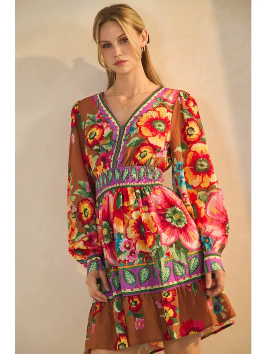 Floral border printed mini dress with smocked waist and cuffed balloon sleeve.